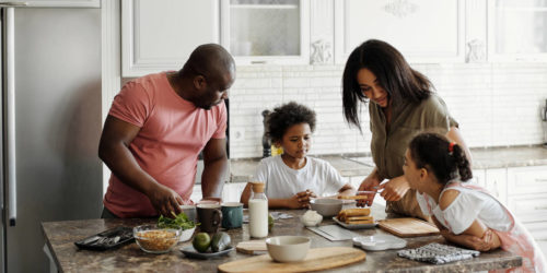 happy family preparing a healthy meal in their kitchen