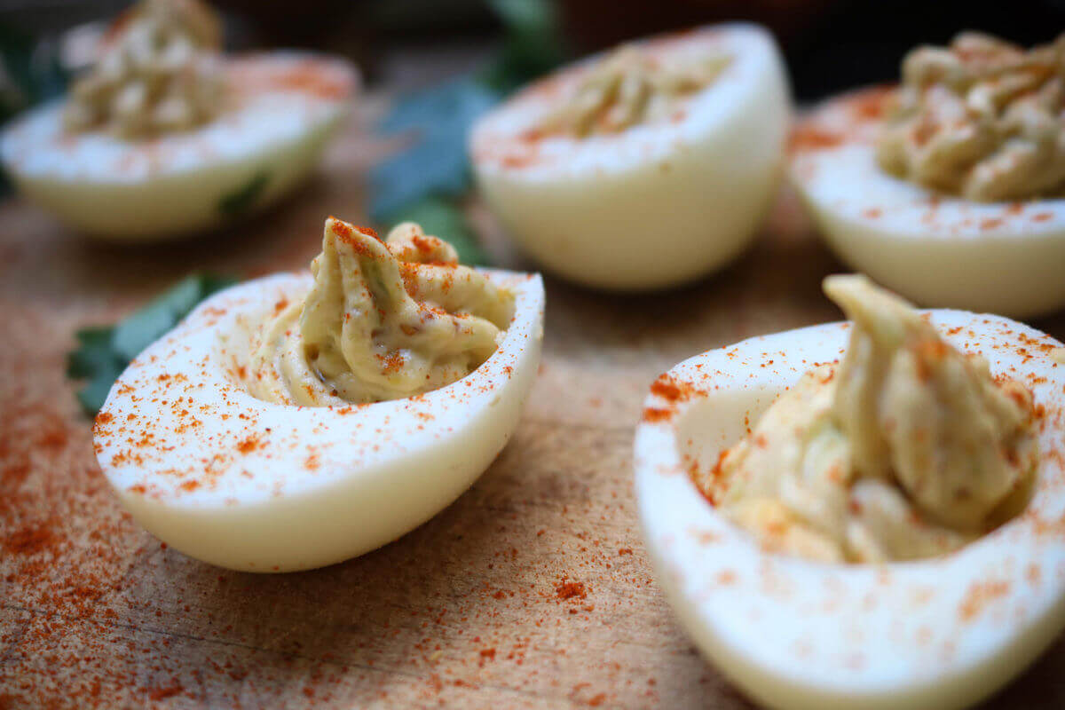 deviled eggs with spinach and avocado
